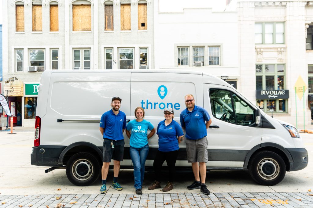 throne ann arbor team in front of the throne van