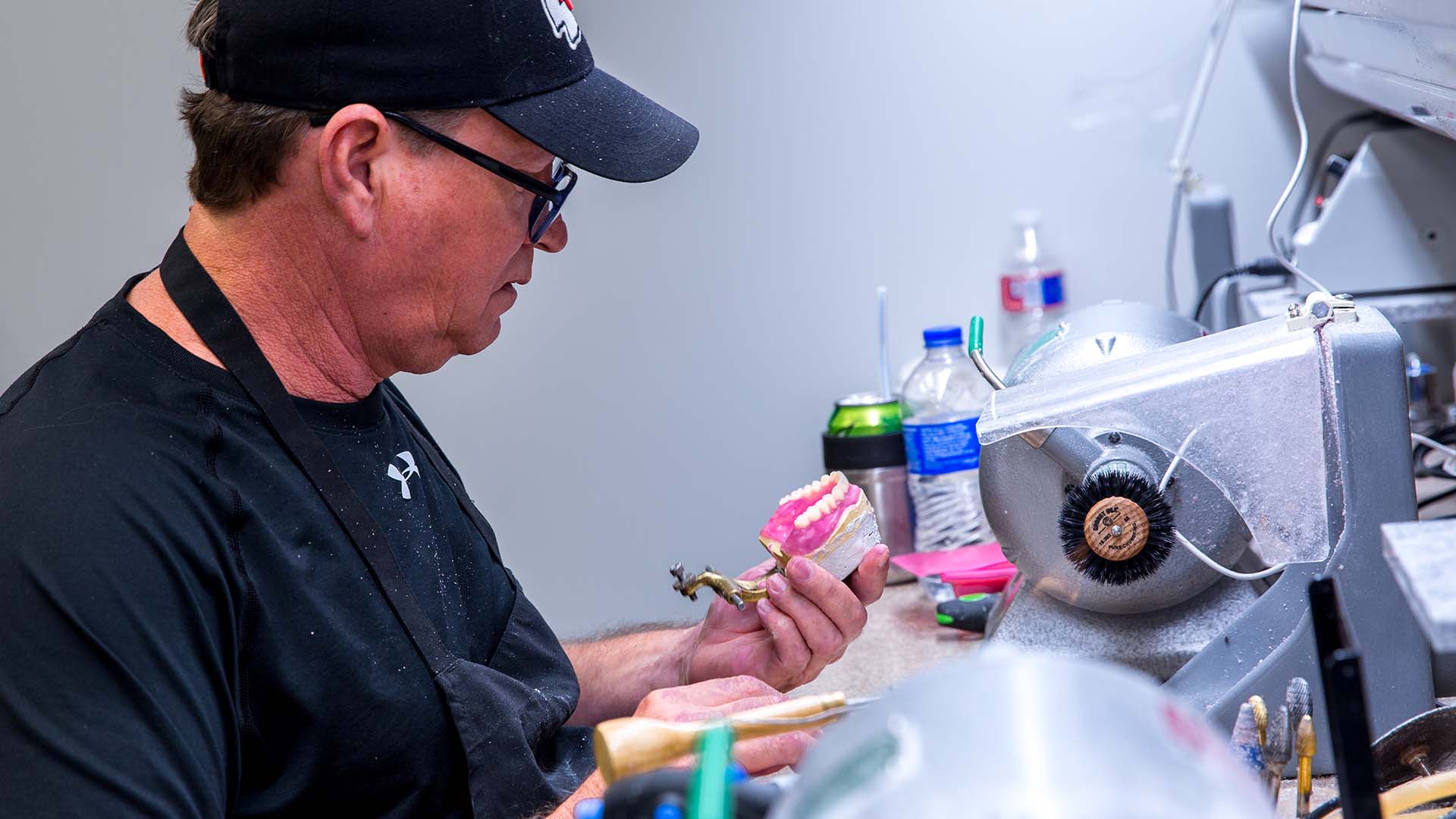 Our on-site lab technician at Restore Dentures and Implants.