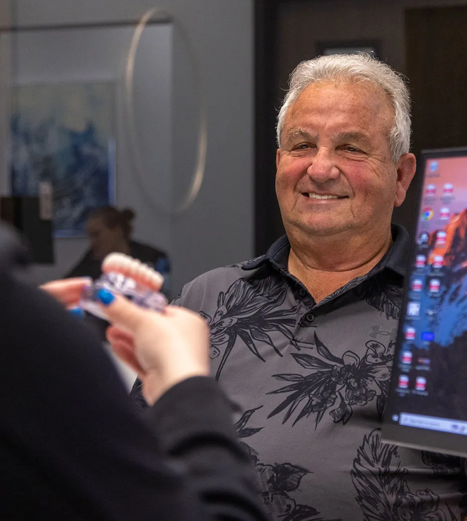 Secure Dentures and Implants patient during denture consultation.