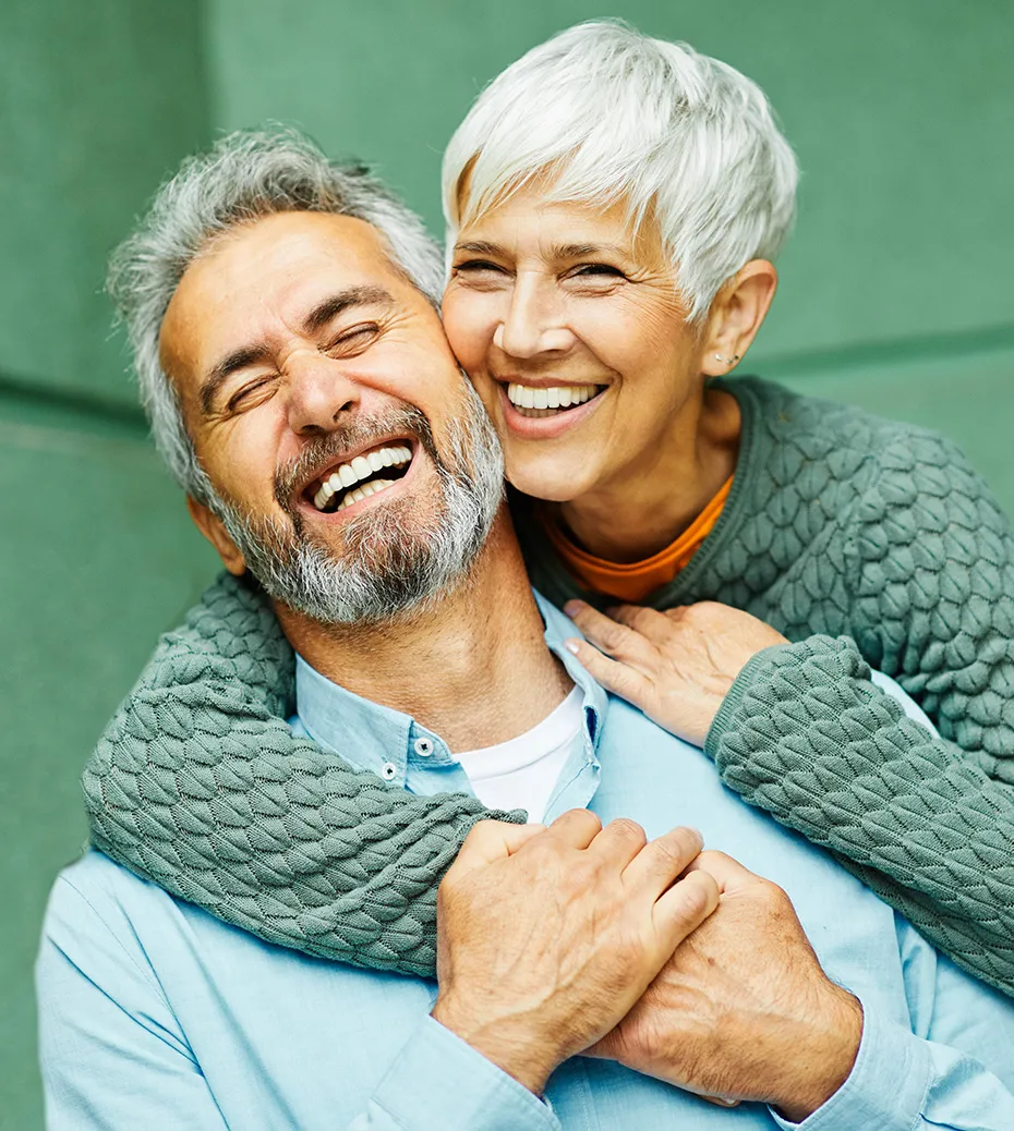 middle aged couple smiling and happy