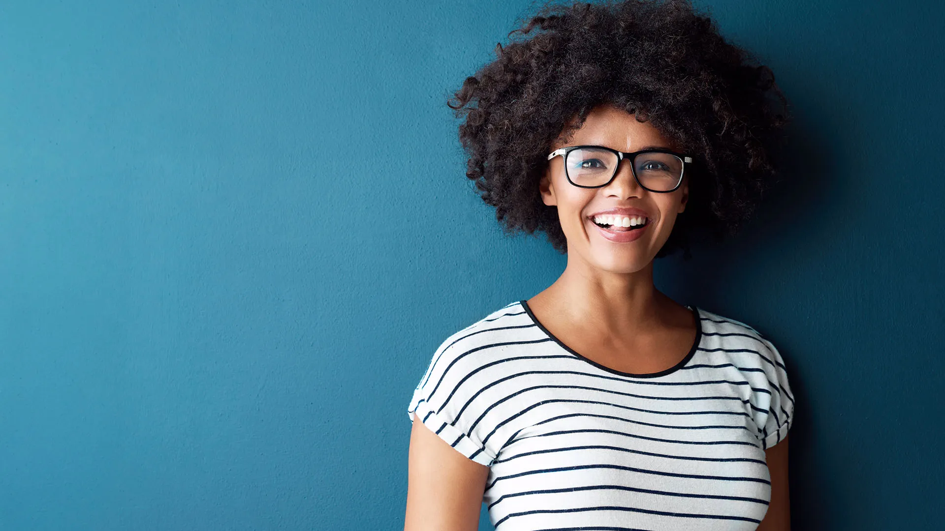Young woman smiling at camera.