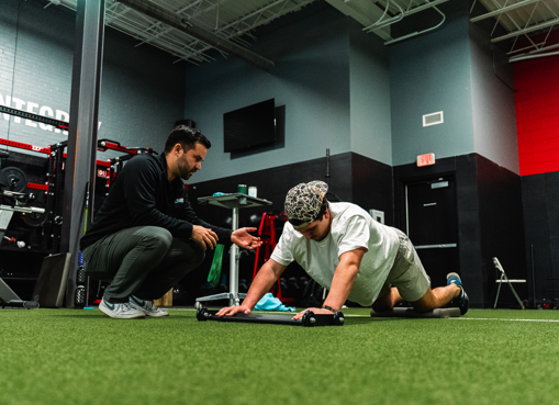 Patient working with a provider at a performance physical therapy clinic in Mount Pleasant, SC during force plate testing