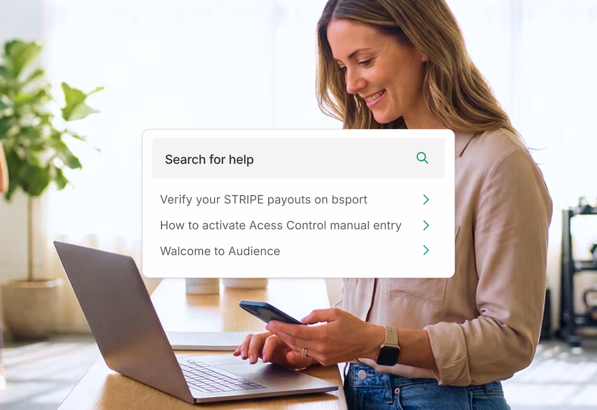 Smiling woman using a smartphone and laptop with a help search interface showing topics like Stripe payouts and access control.