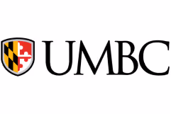 UMBC university logo featuring a shield with a red and yellow pattern.