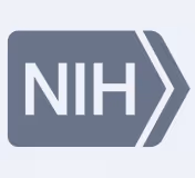 National Institutes of Health (NIH) logo in white on a gray arrow-shaped background.