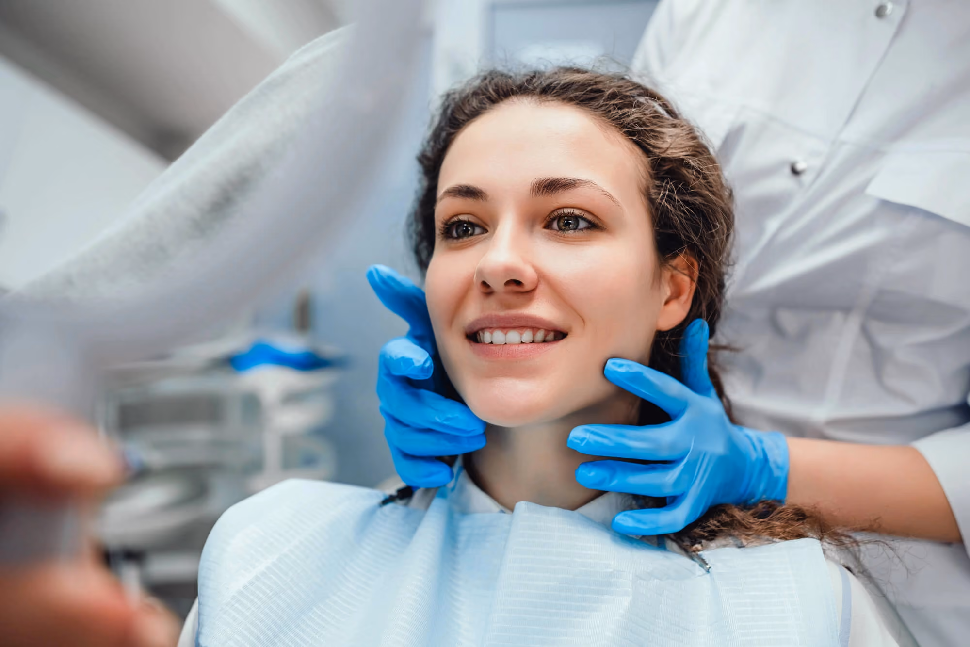Patient admiring smile in mirror