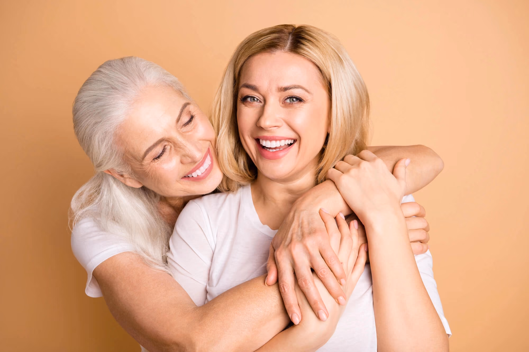 Older woman hugging and smiling