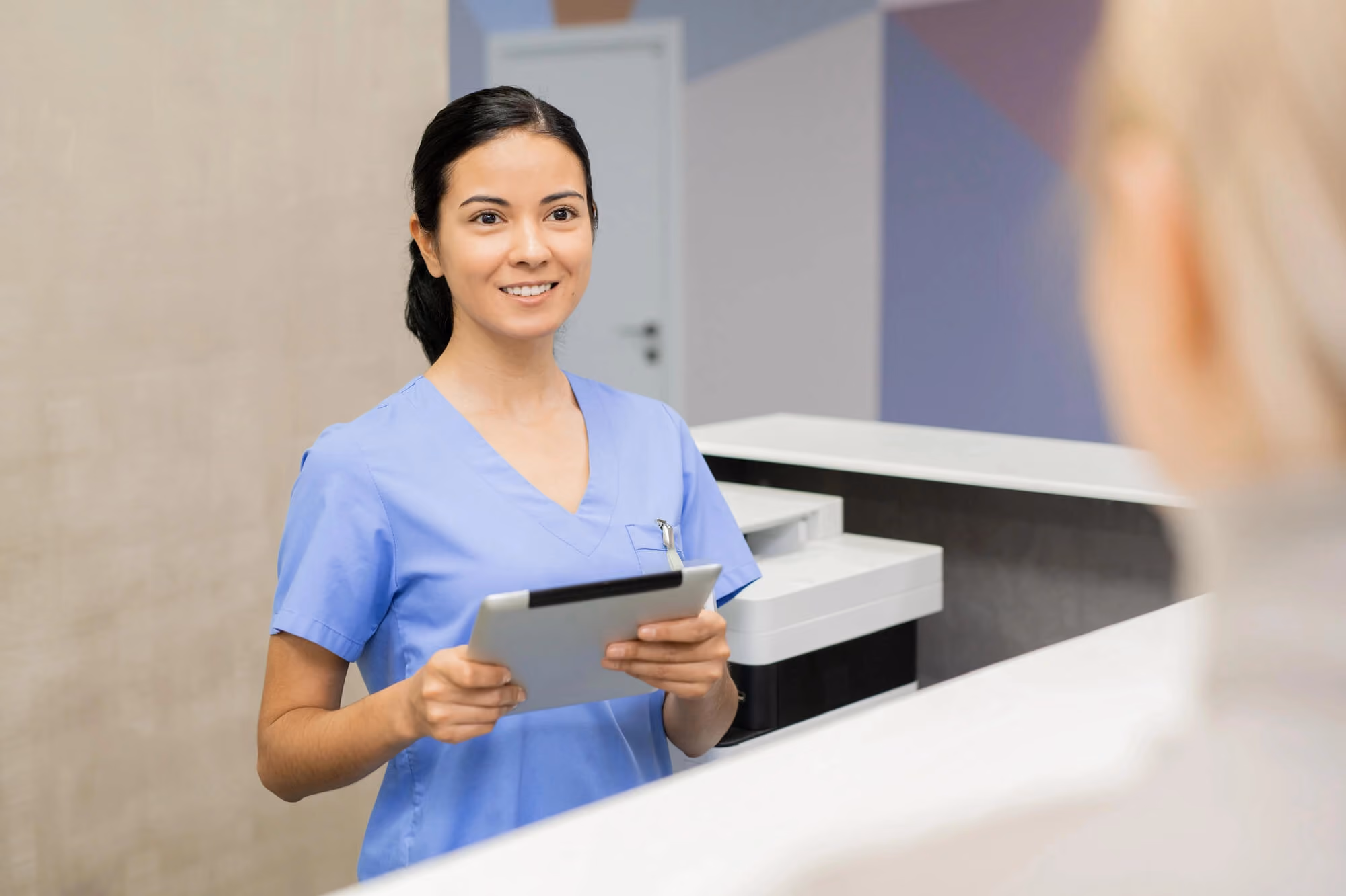 receptionist holding a form