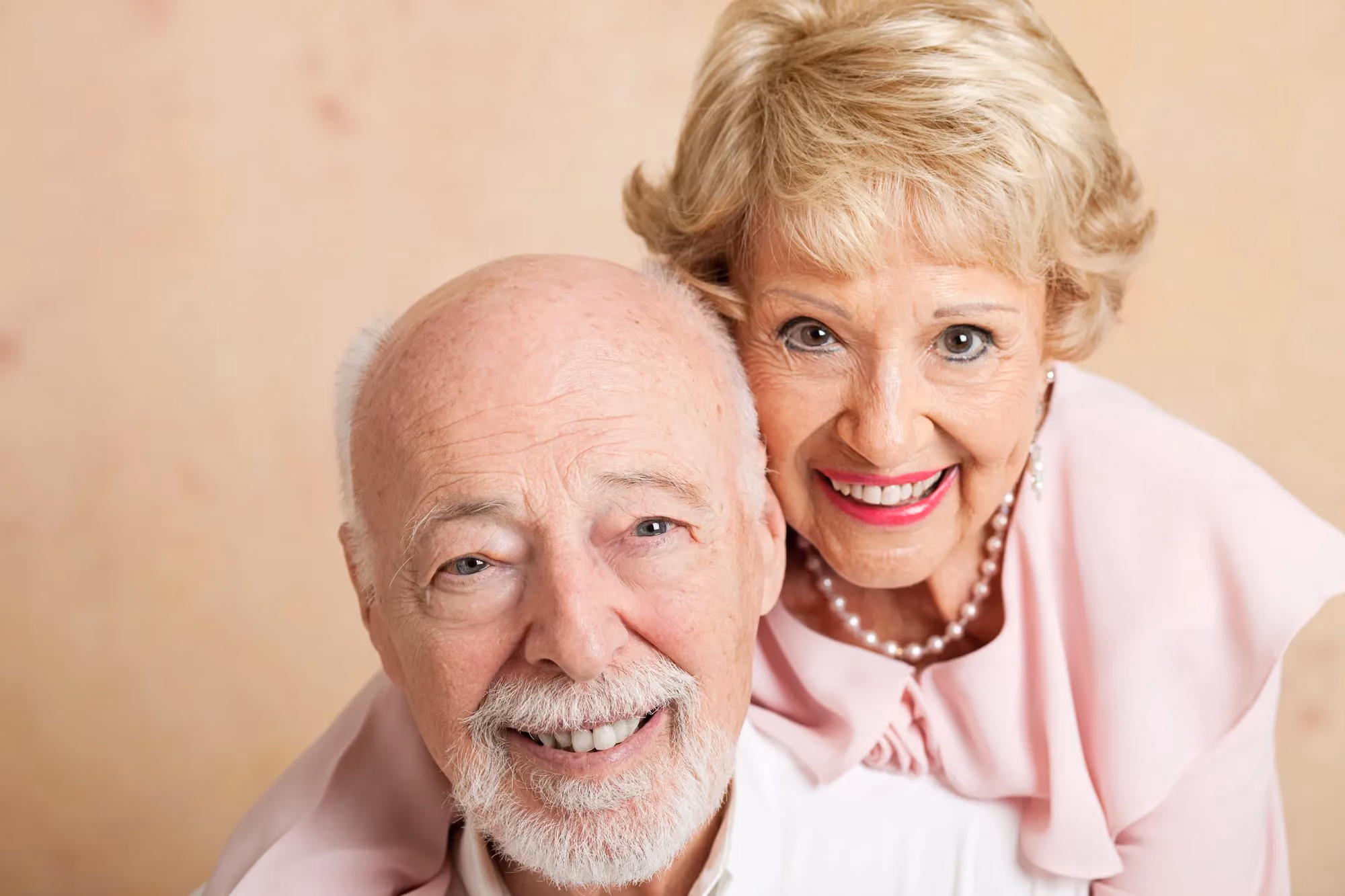 older woman and man smiling
