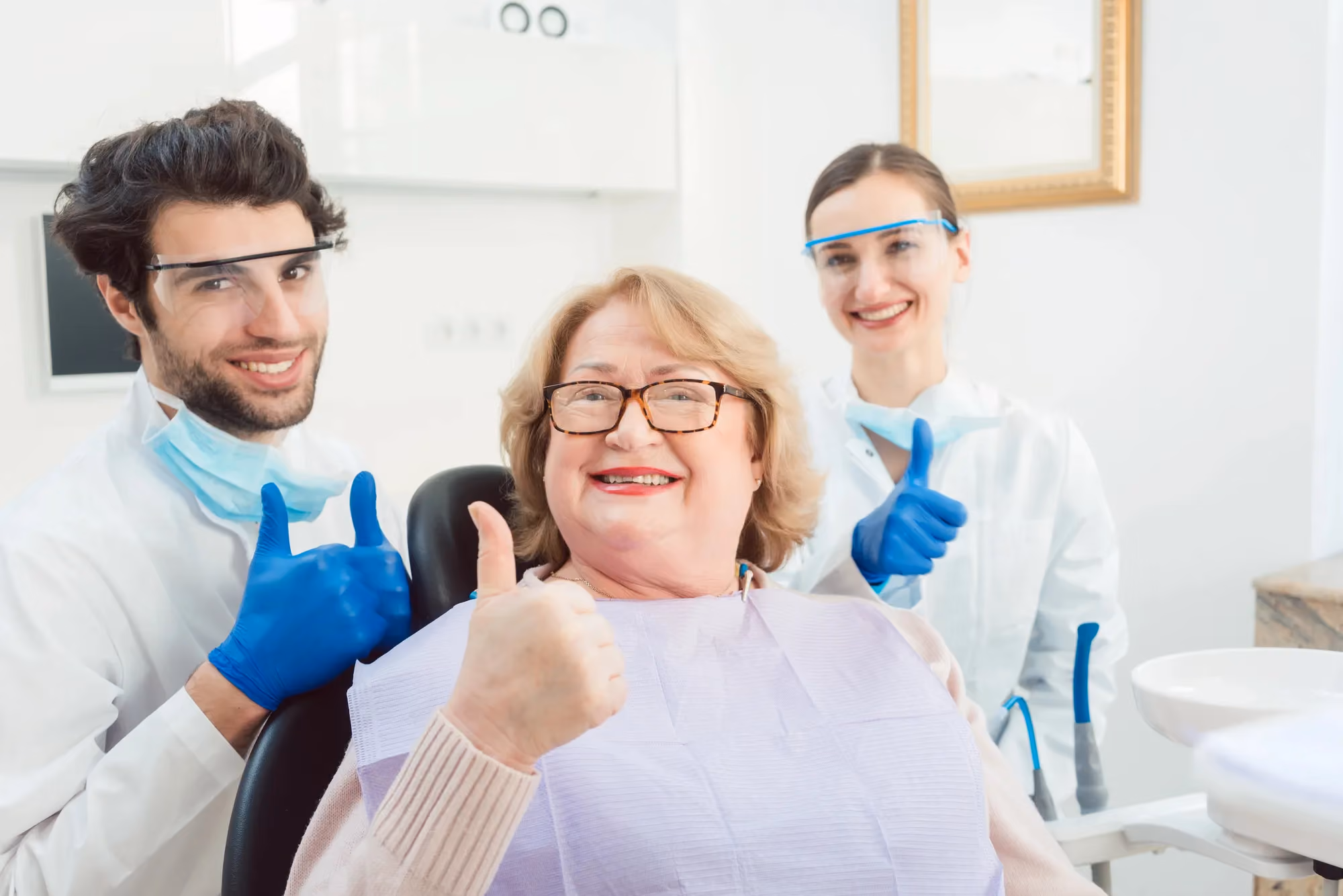 Woman smiling giving thumbs up