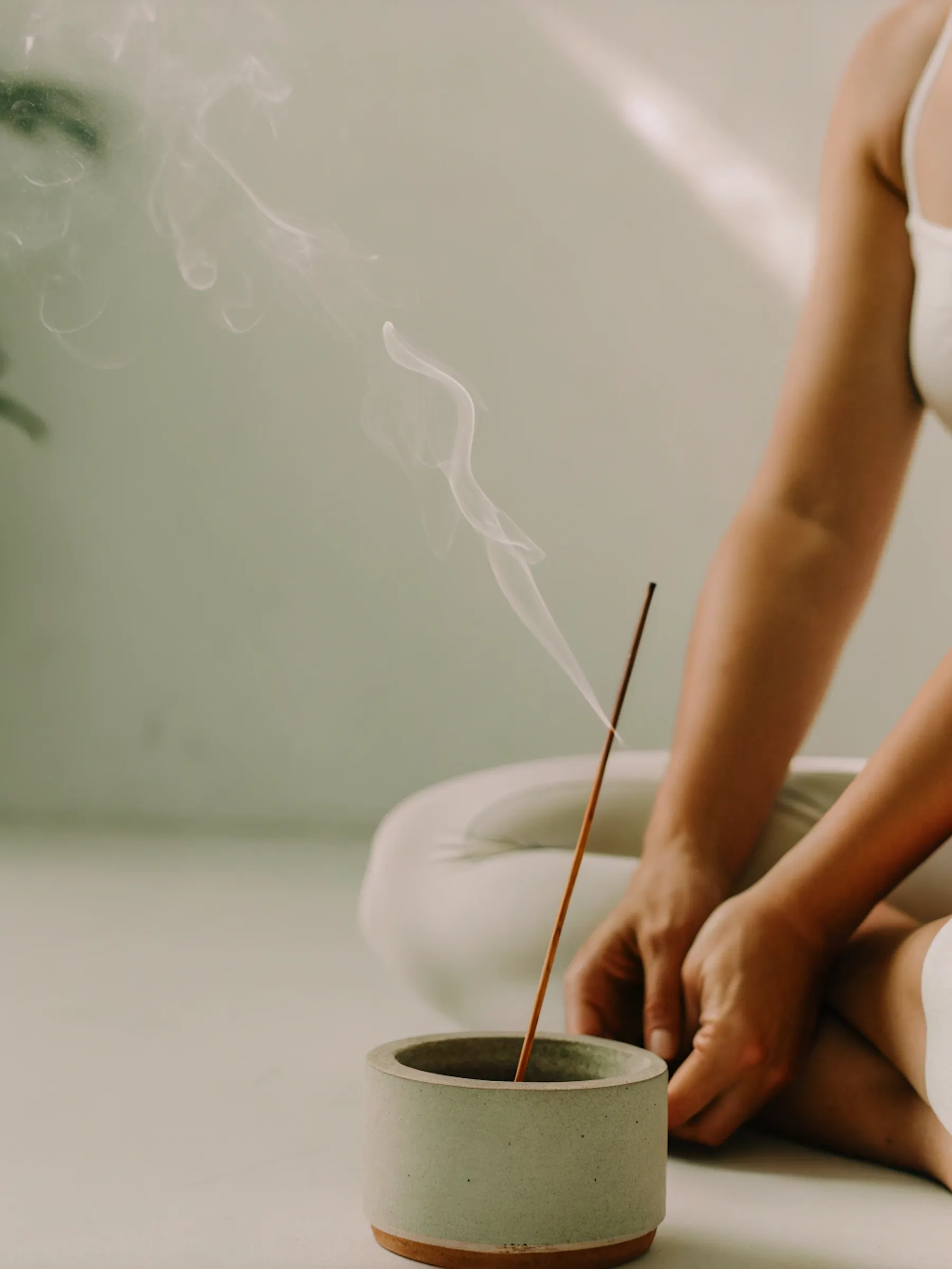 Hands holding yoga mat close-up