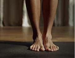 Person entering yoga studio barefoot