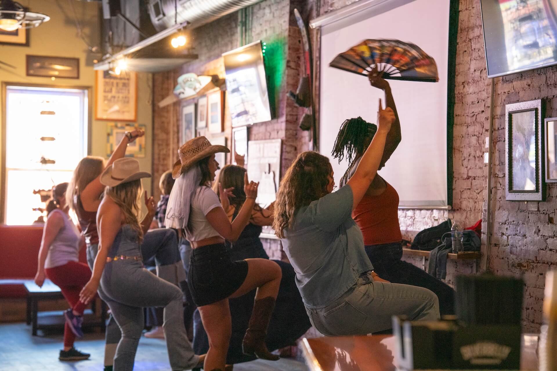Group participating in a lively dance class img