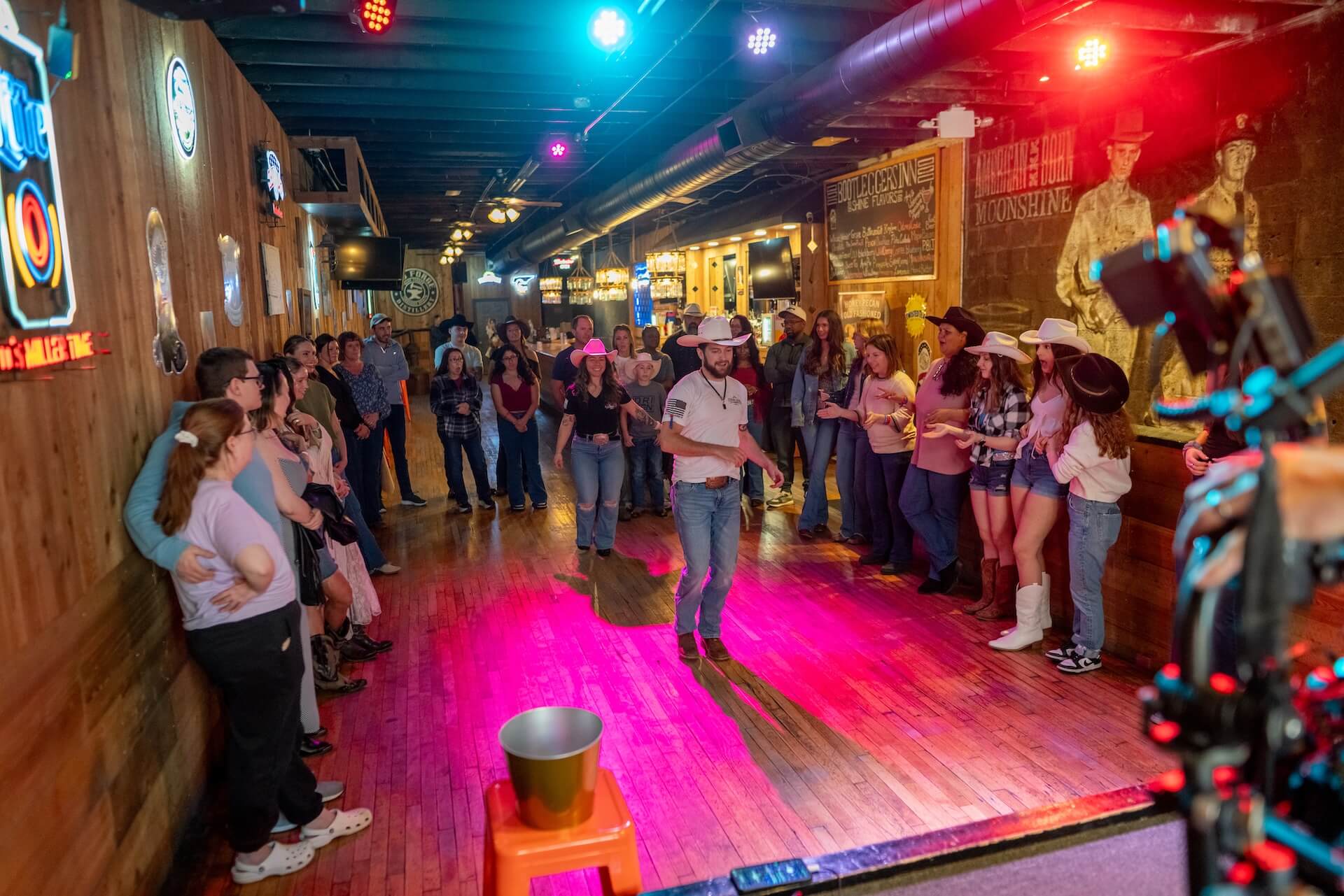 Line-dance instructor demonstrating steps to a group img