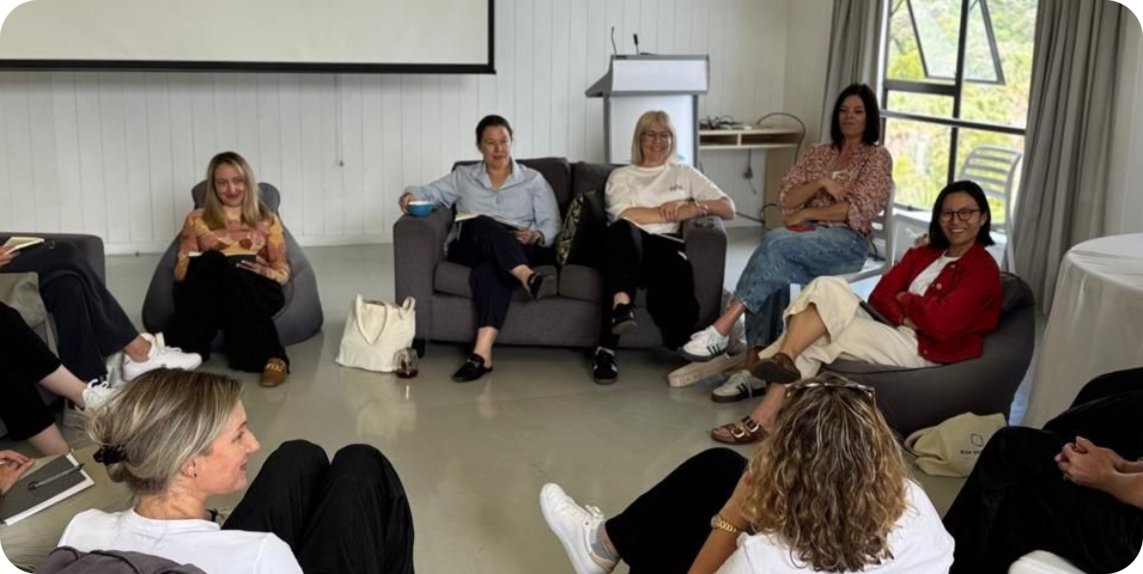 A photo an awesome connecta event - of a team all sitting together talking