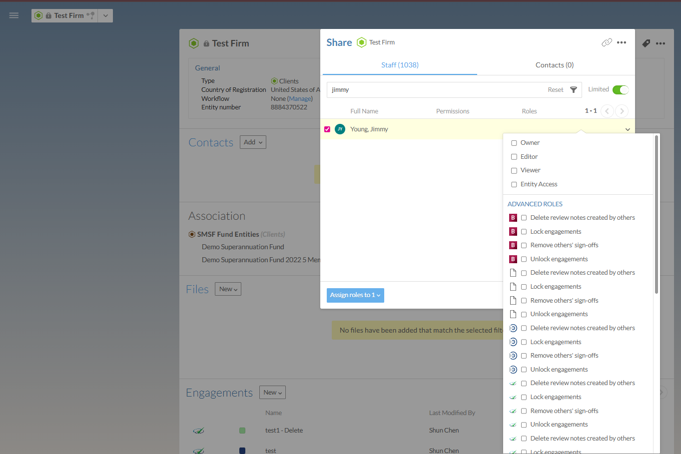 The Share dialog for a firm showing the Staff tab with a user selected and a drop-down menu listing role options including Owner, Editor, Viewer, and Entity Access, and advanced roles grouped by product type including Delete review notes created by others, Lock engagements, Remove others' sign-offs, and Unlock engagements.