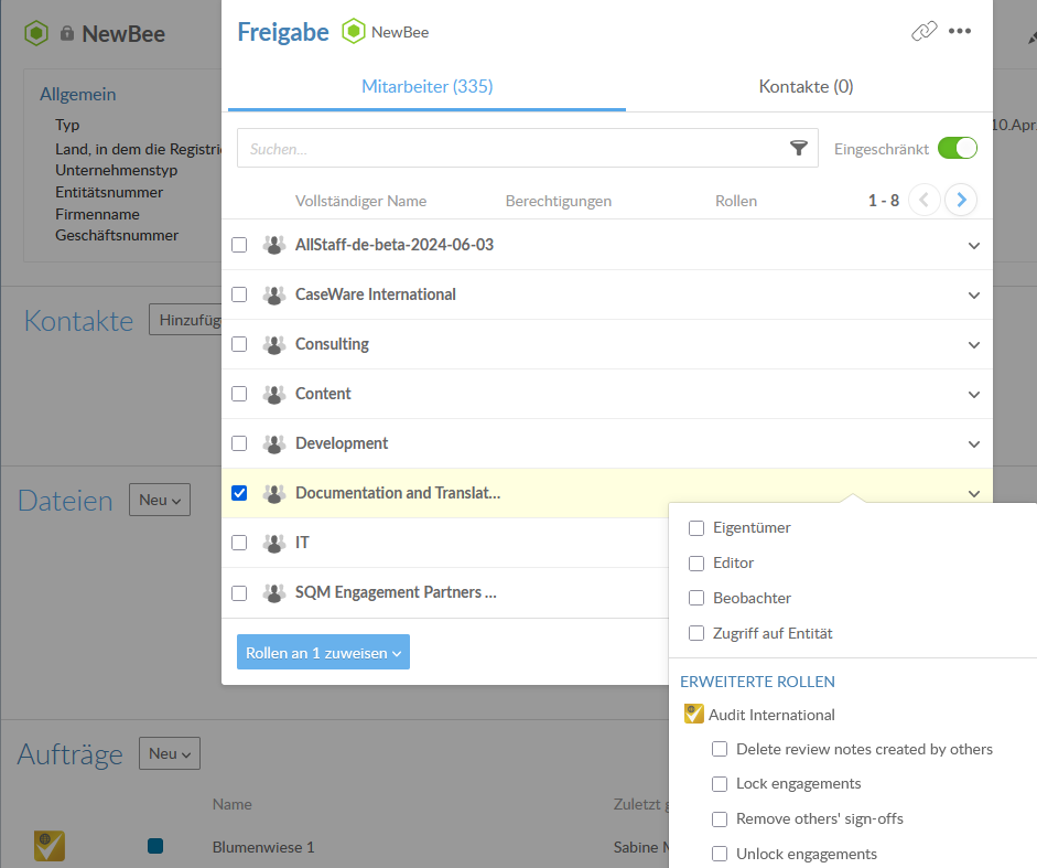 The Share dialog for a firm showing the Staff tab with a user selected and a drop-down menu listing role options including Owner, Editor, Viewer, and Entity Access, and advanced roles grouped by product type including Delete review notes created by others, Lock engagements, Remove others' sign-offs, and Unlock engagements.