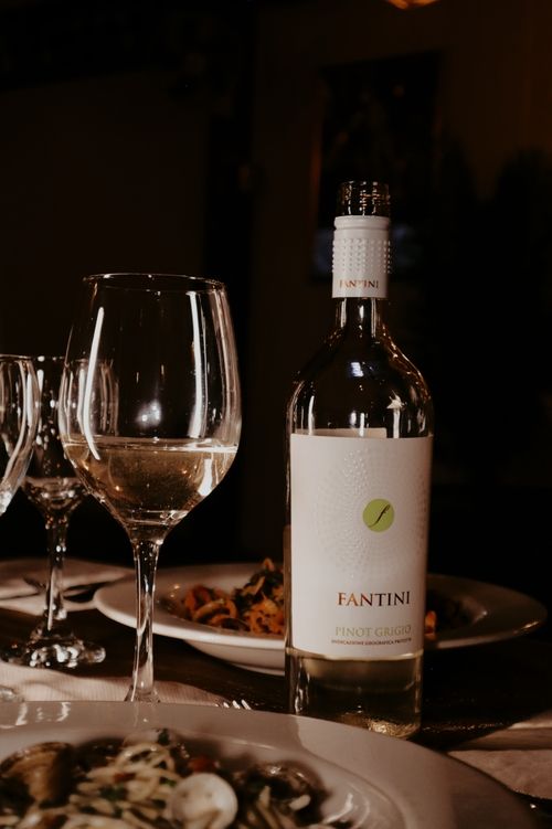 image of visitors enjoying wine tasting at a winery