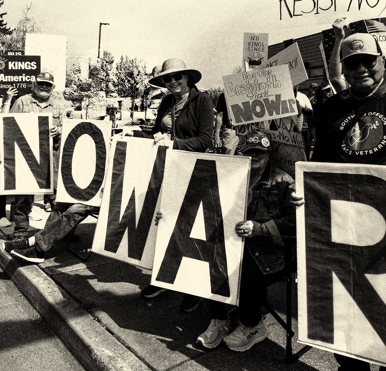 protesters holding "no war" signs