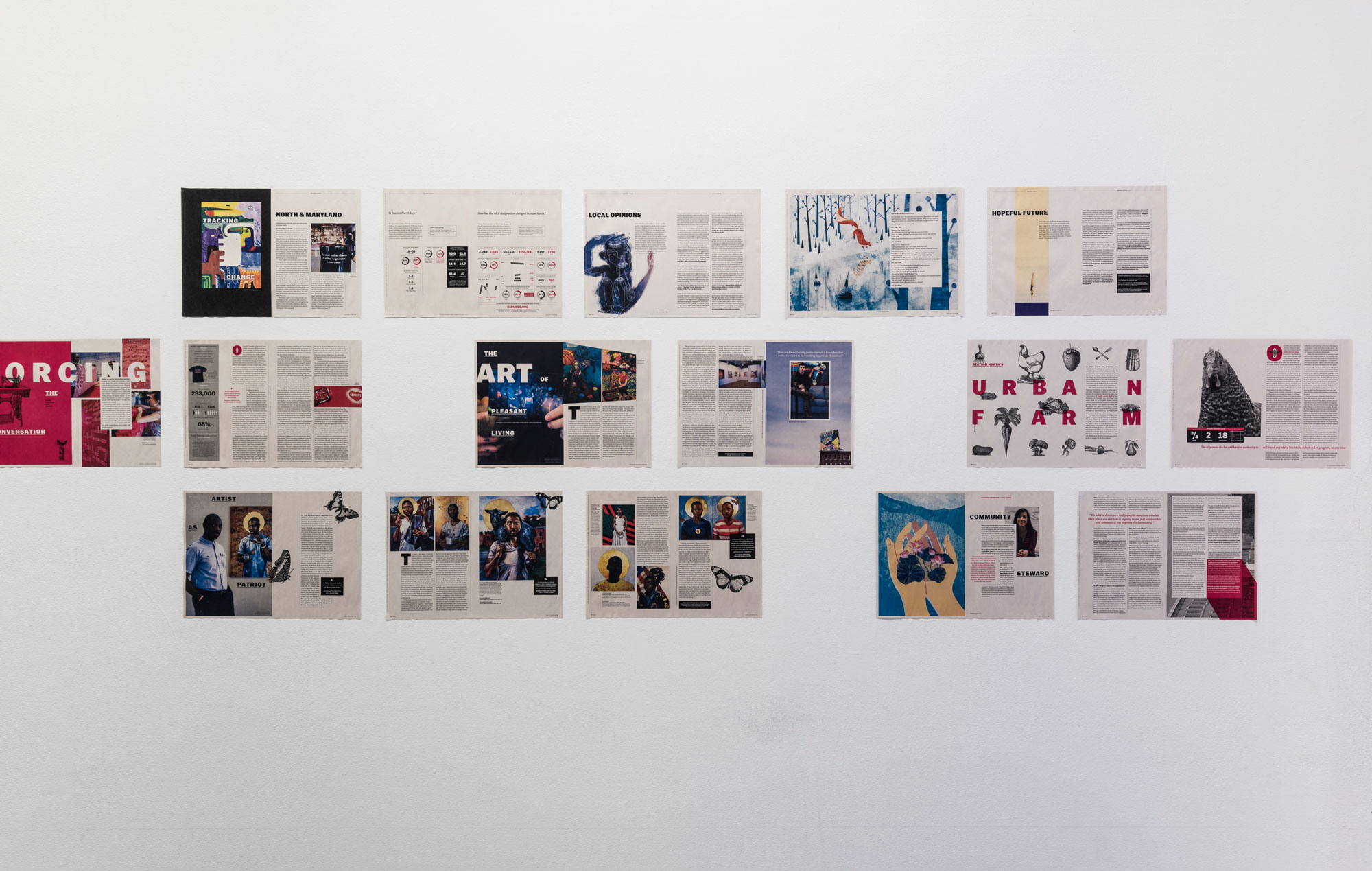 publication spreads hanging on the wall