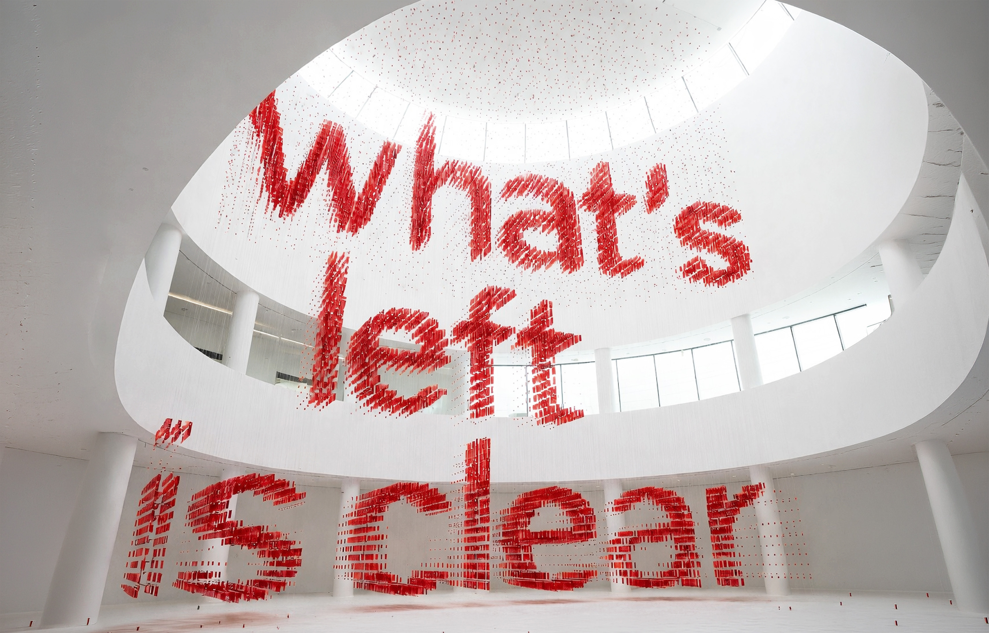 A hand pulling a bottle of Fizz Kombucha out of the pack.