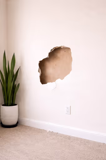 Room wall with drywall damage - providing professional handyman services in Simi Valley.