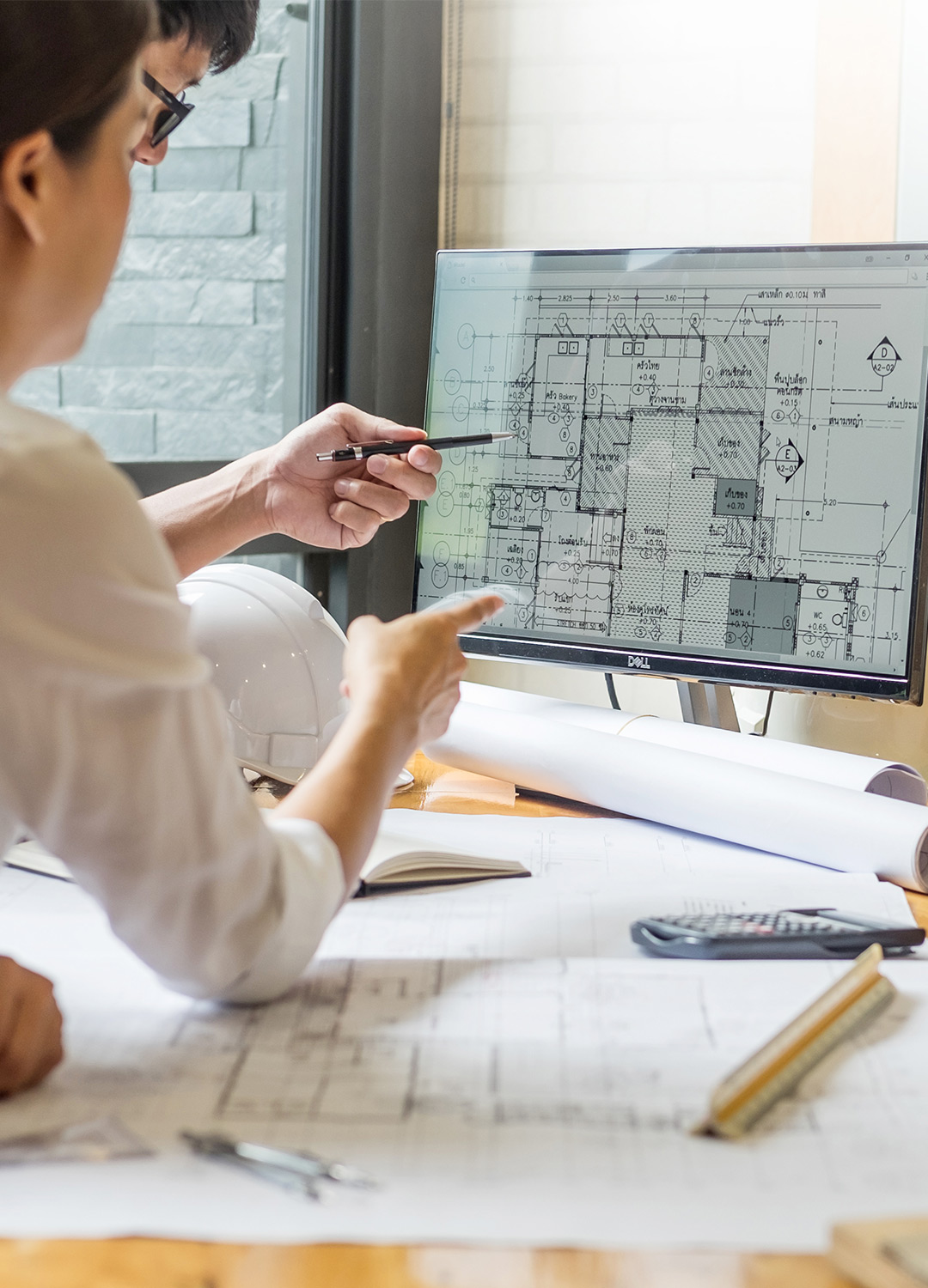 Engineers Looking at Computer Drawings