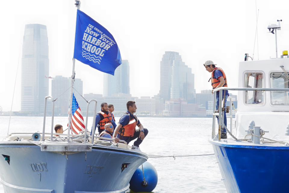 Harbor School students in life vests aboard training vessels in New York Harbor