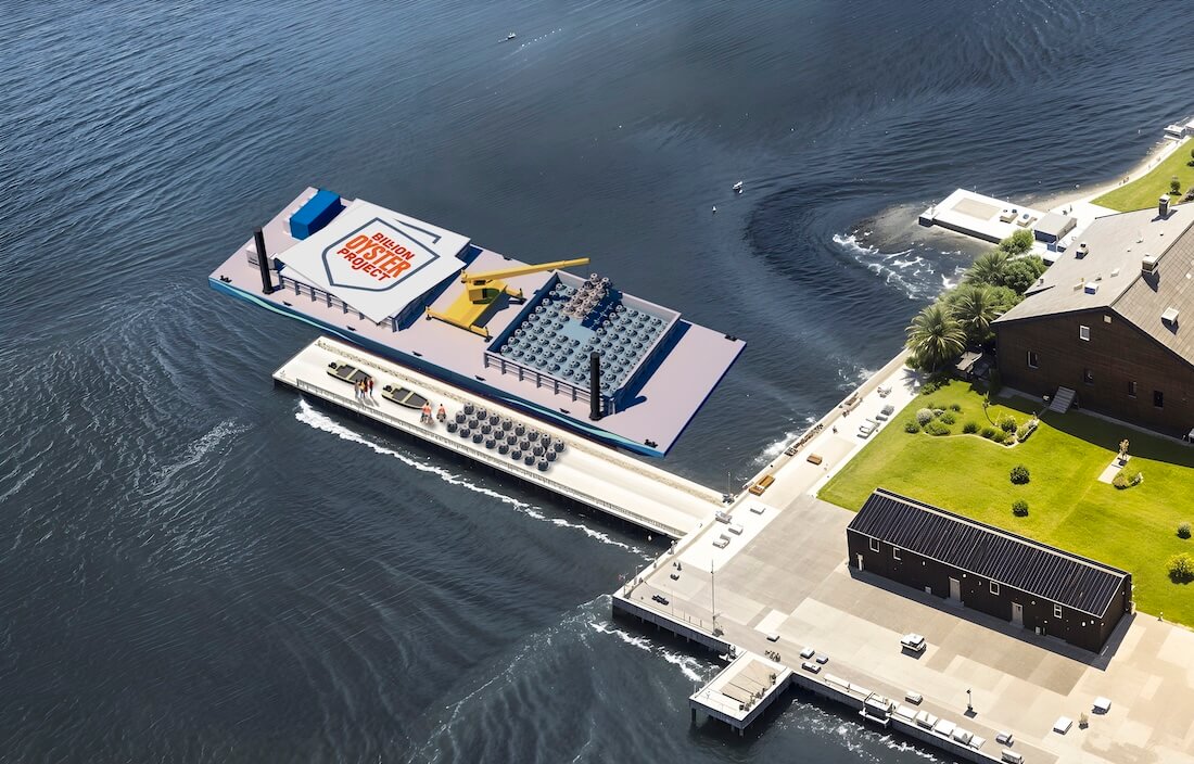 Aerial concept rendering of a Billion Oyster Project reef barge loading concrete reef structures at a pier