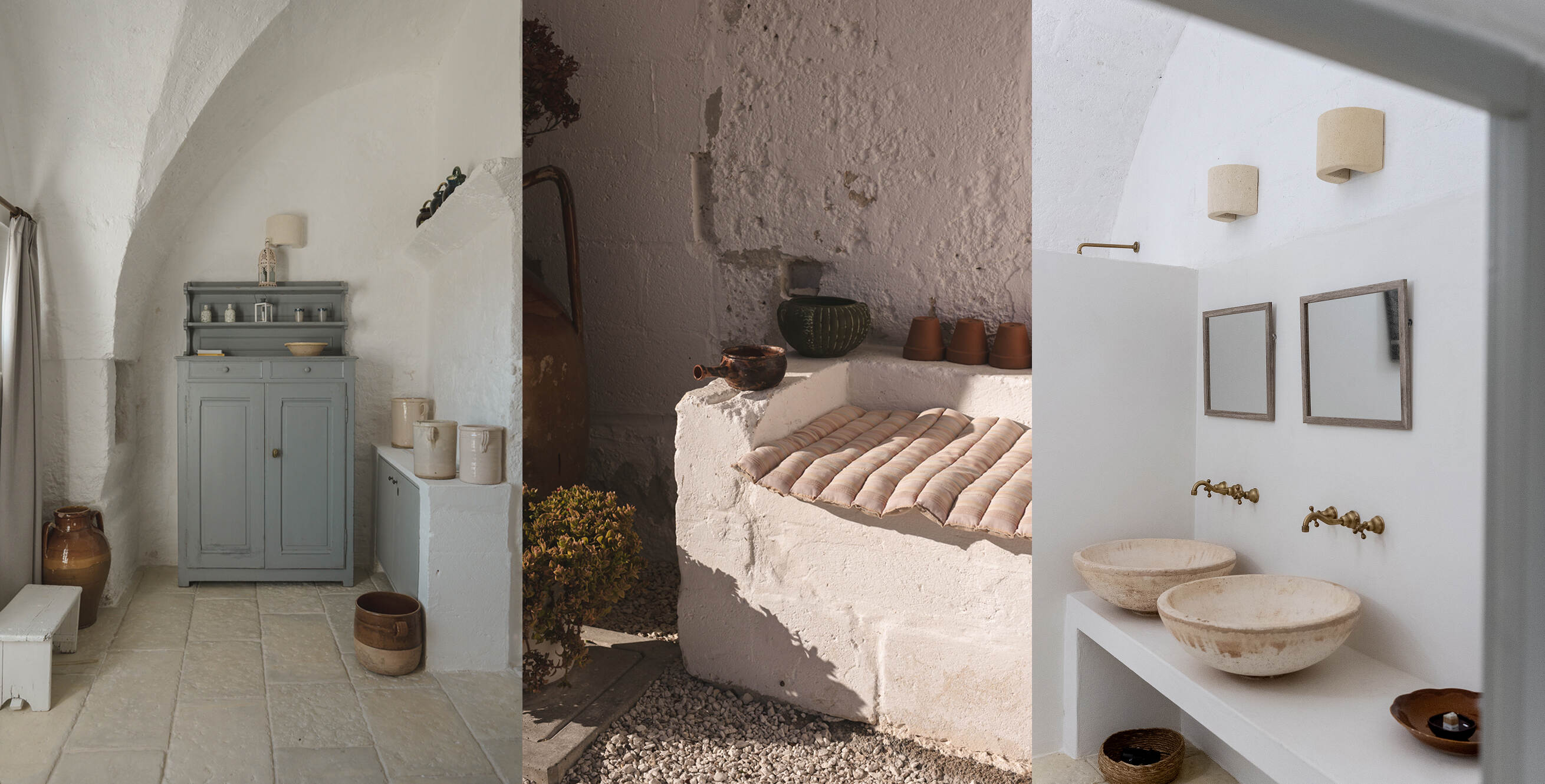Triptych of interior scenes with rustic and minimalist decor: left panel shows a gray cupboard with jars and pottery under a white arched ceiling; center panel shows a white stone bench with a striped cushion and clay pots against a textured wall; right panel shows a white bathroom with two round stone sinks, brass faucets, and two mirrors above a built-in counter.