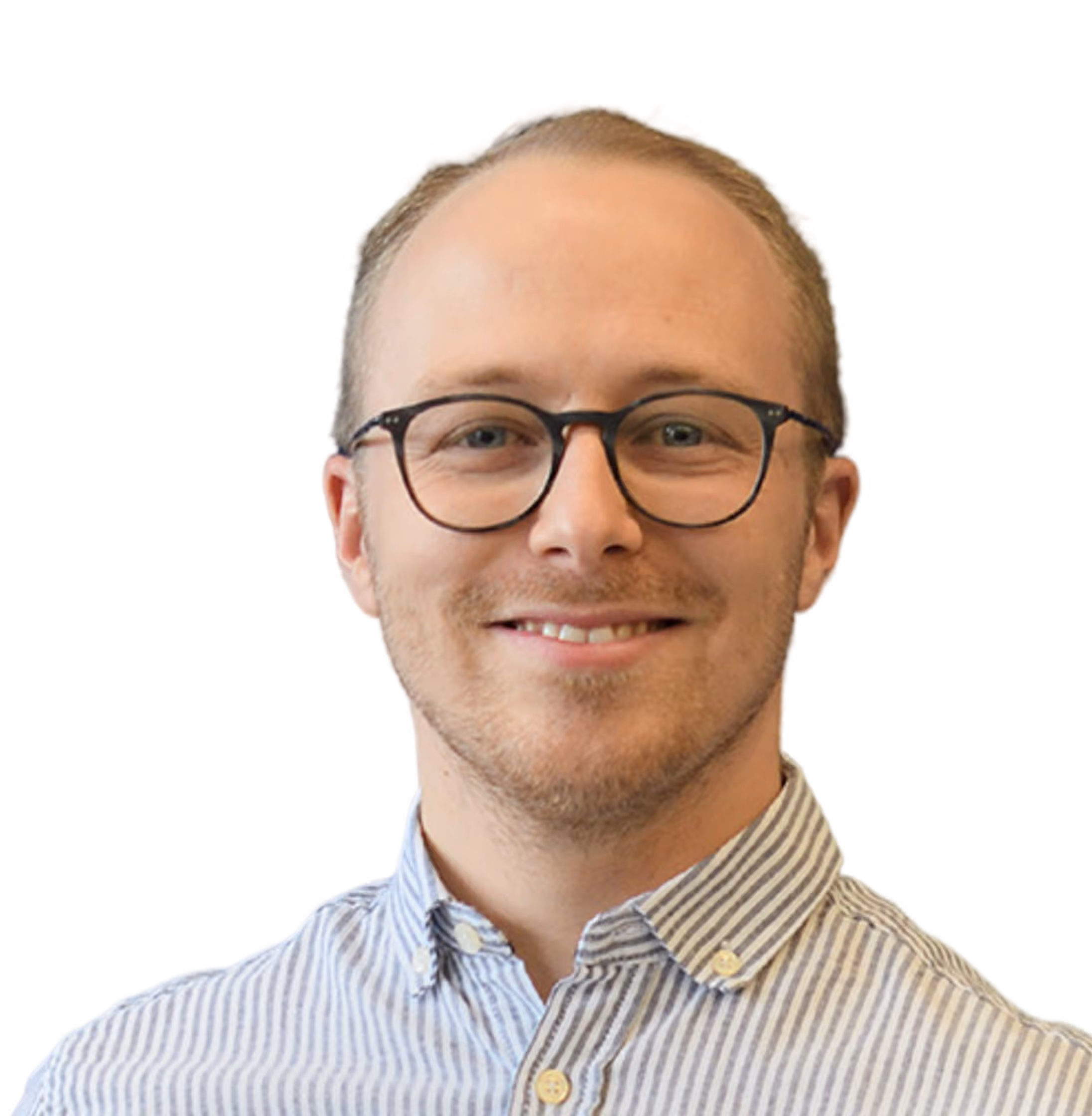 Smiling man with glasses wearing a striped button-up shirt against a plain background.