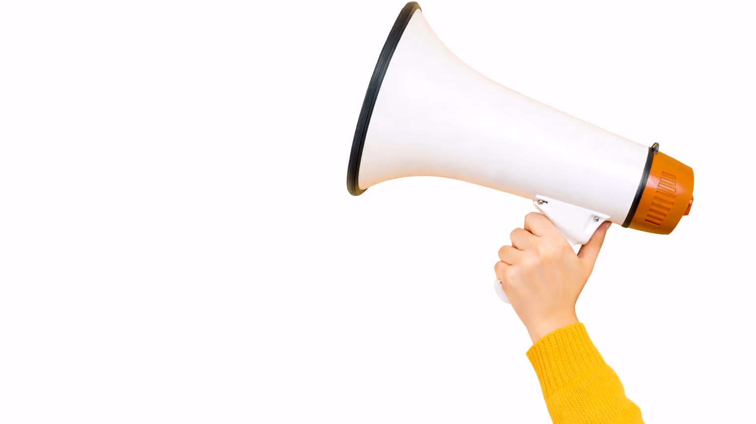Hand holding a white and orange megaphone on a white background.