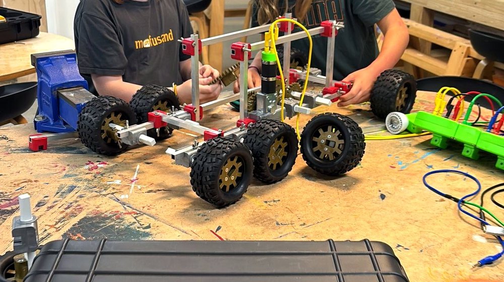 Students building a robot