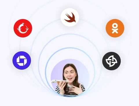 Smiling young woman speaking into a smartphone surrounded by five colorful app icons arranged in a circular pattern.