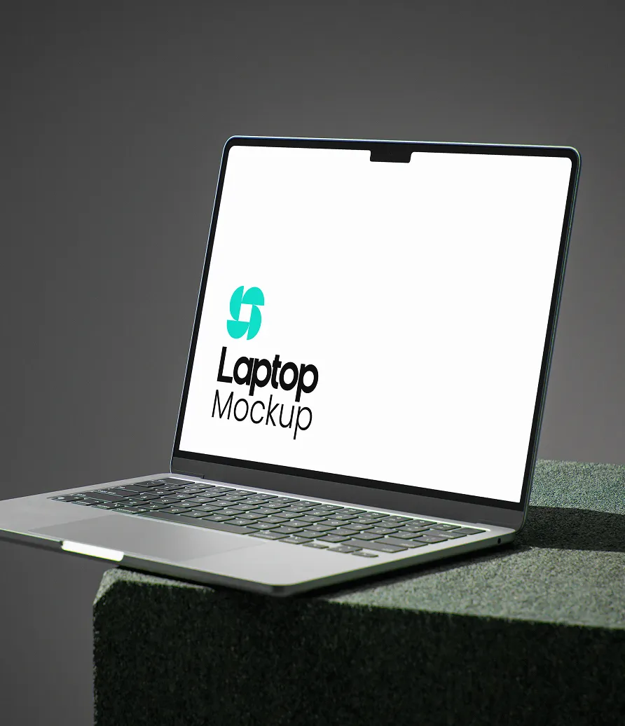 Open laptop displaying a white screen with the text 'Laptop Mockup' and a blue abstract logo on a dark gray textured pedestal.