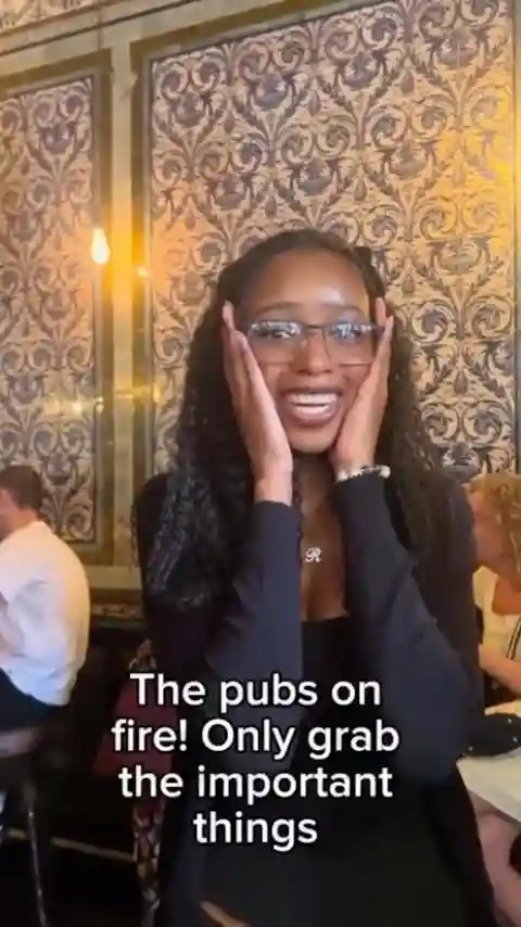 The pub’s on fire… everyone’s got their priorities straight!