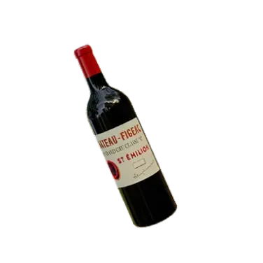 A bottle of red wine on a black background.