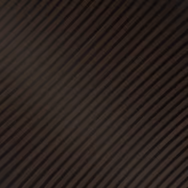Dark brown surface with diagonal black stripes creating a textured pattern.