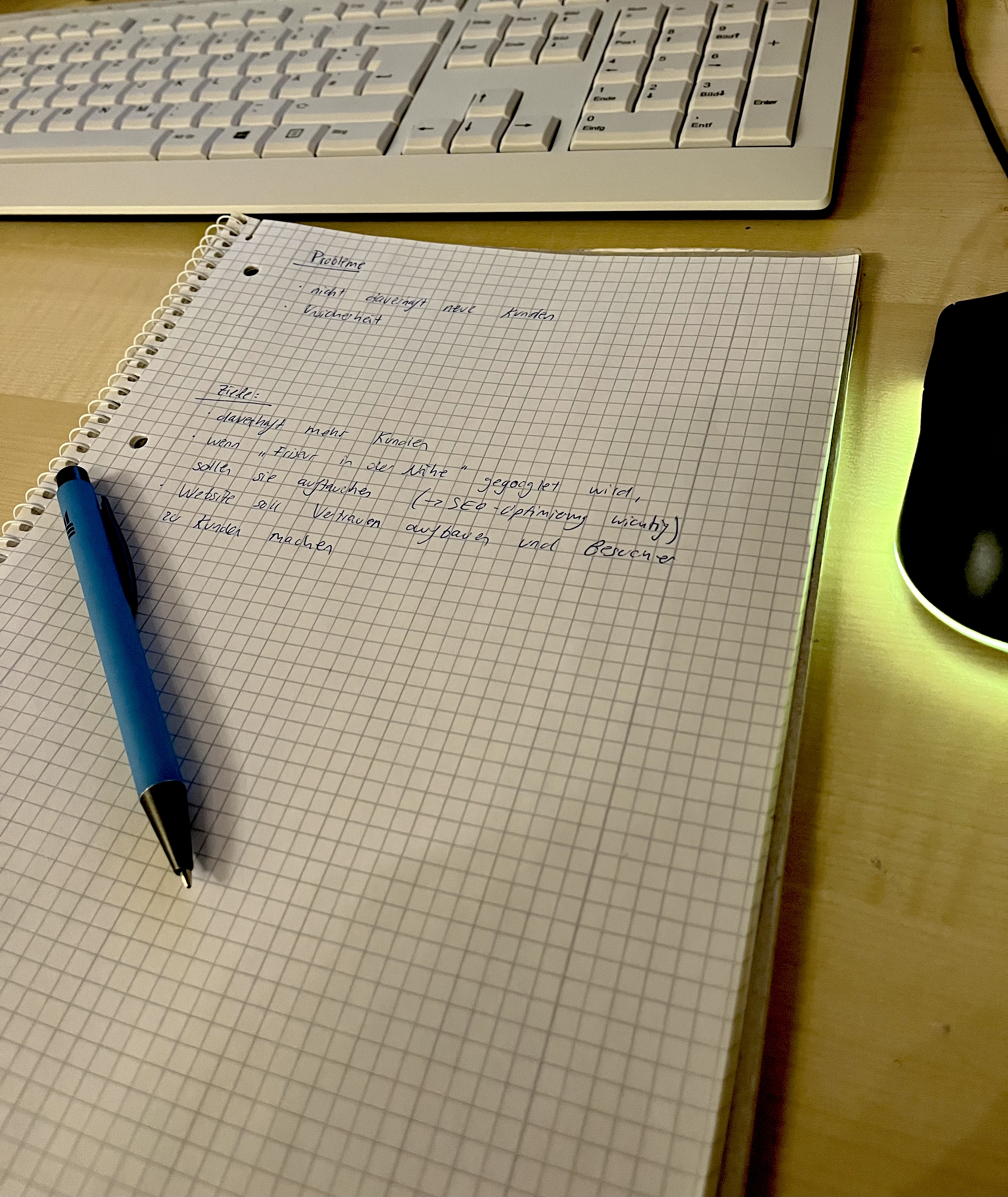close up of a sheet of paper with notes. There is a pencil laying on the notes and a mouse next to these notes.