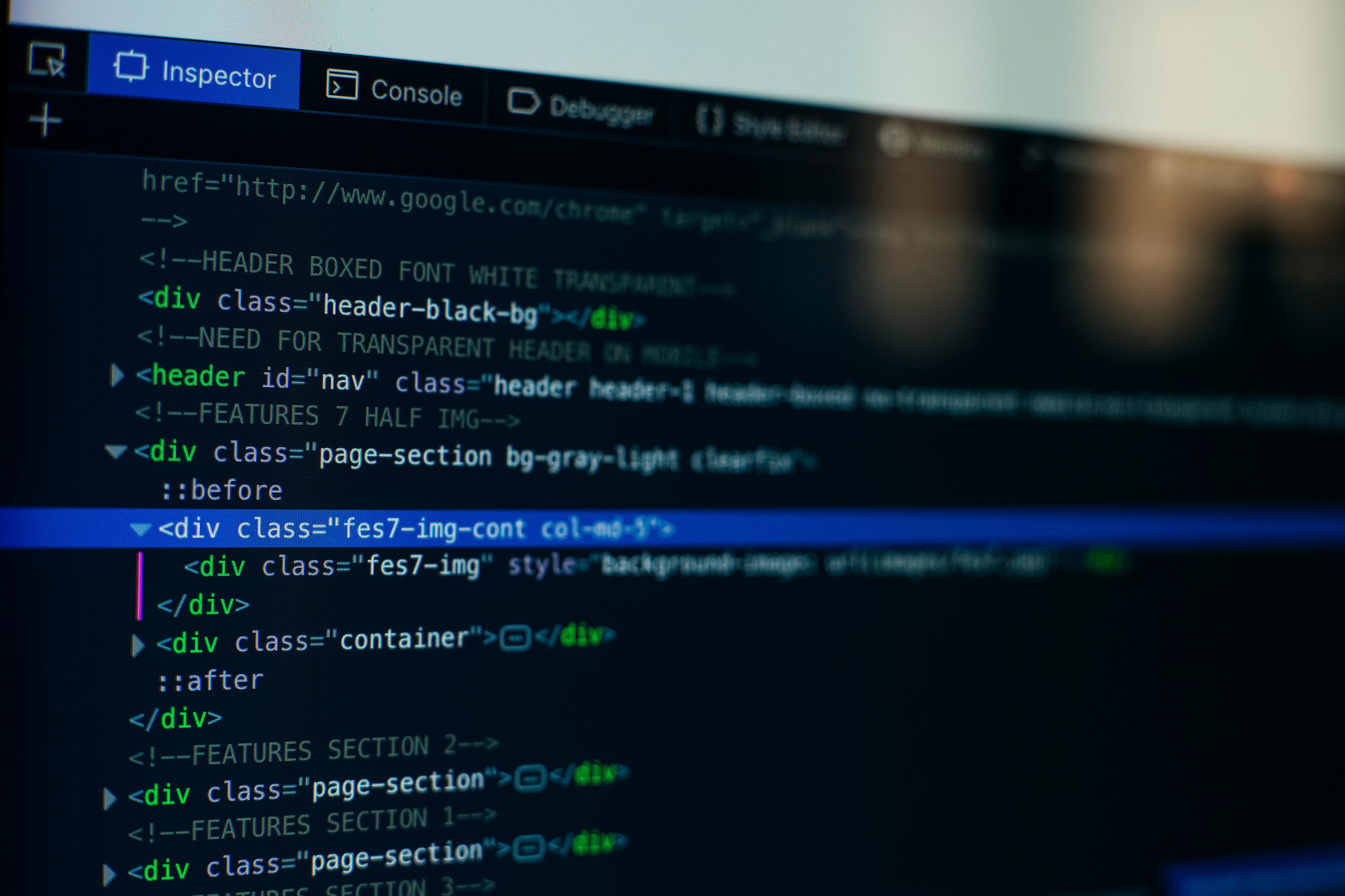 Computer screen displaying HTML code with div, header, and class attributes in a code editor under Inspector tab.