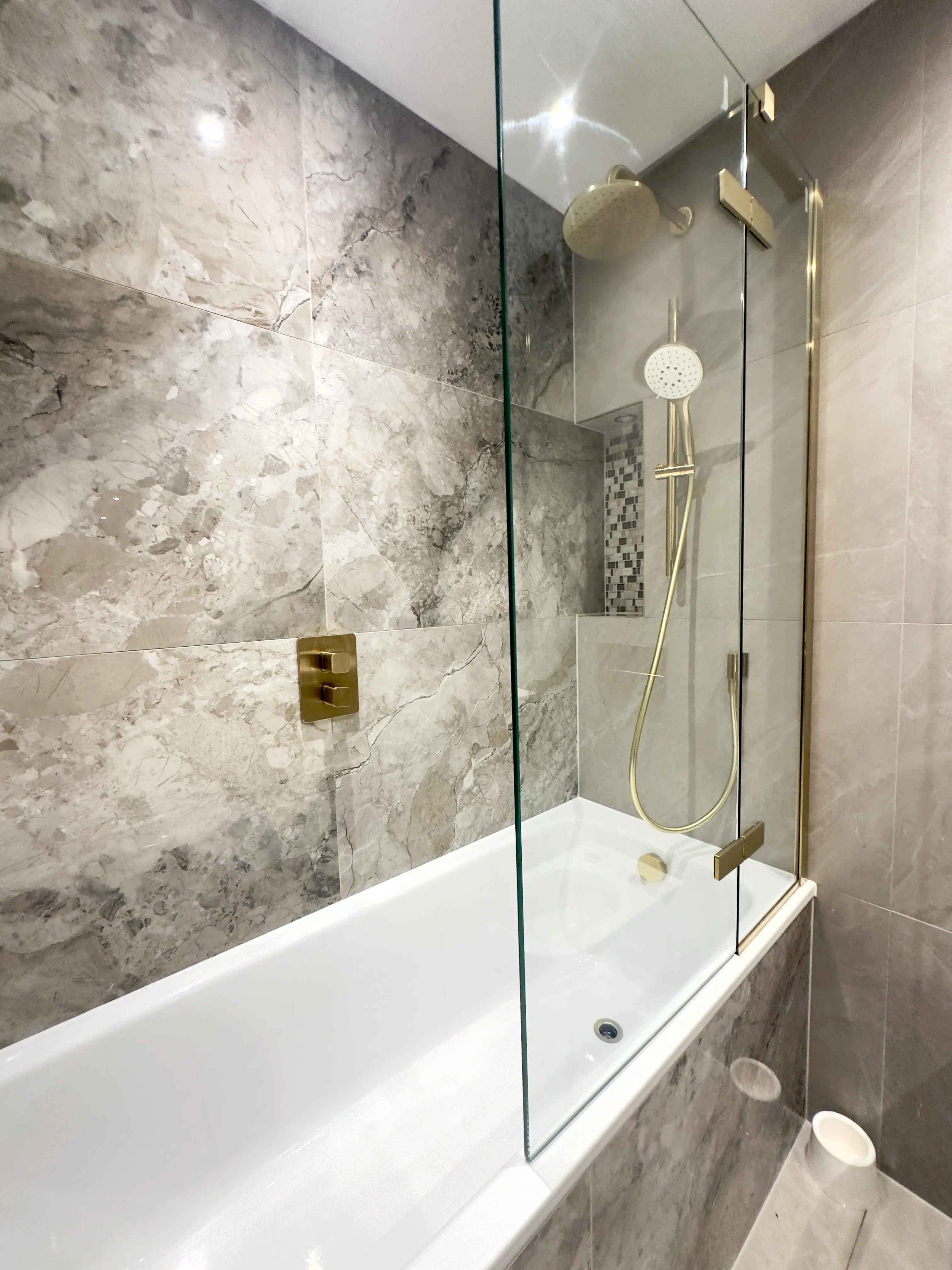 London bathroom with brushed-gold fittings professionally cleaned by Tidy Hub