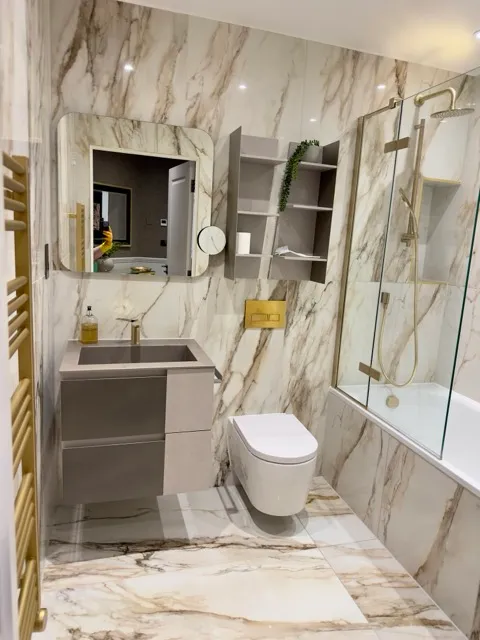 Luxury marble bathroom after post-renovation cleaning by Tidy Hub