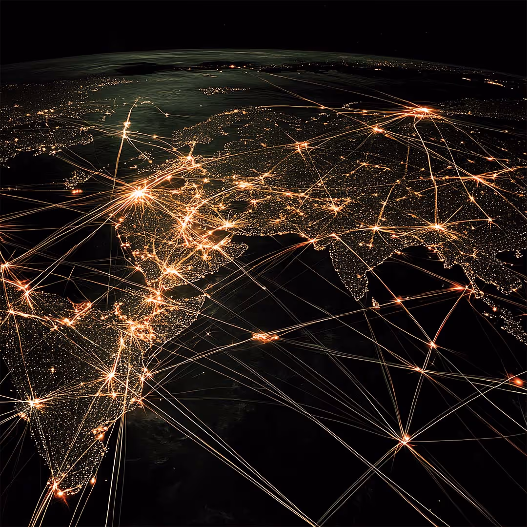 Satellite view of Earth at night showing illuminated cities and interconnected glowing lines representing global network connections across Europe, Asia, and Africa.