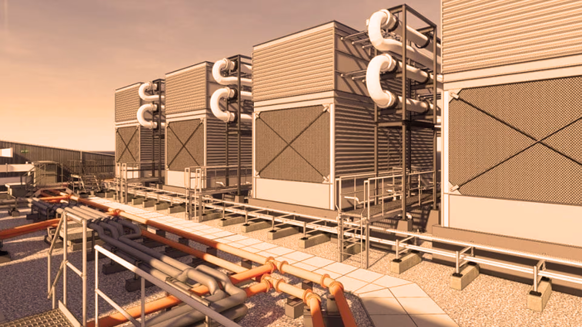 Industrial cooling units with multiple large pipes and walkways in an outdoor facility under a sunset sky.