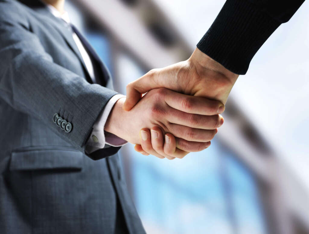 shaking hands after private practice lease renewal negotiation