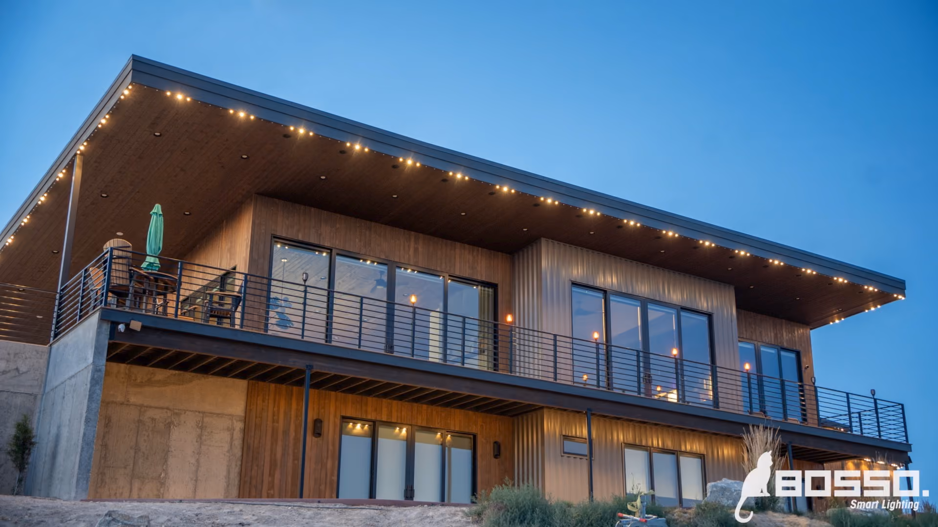 Permanent outdoor lighting system illuminating a house