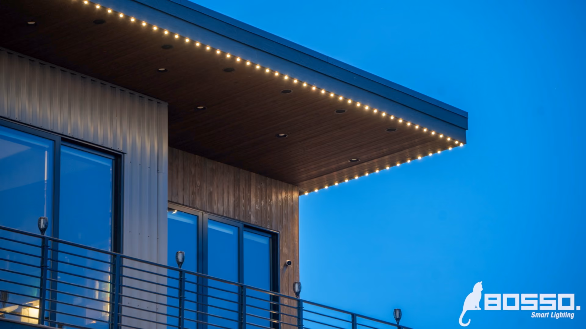Permanent outdoor lighting system illuminating a house