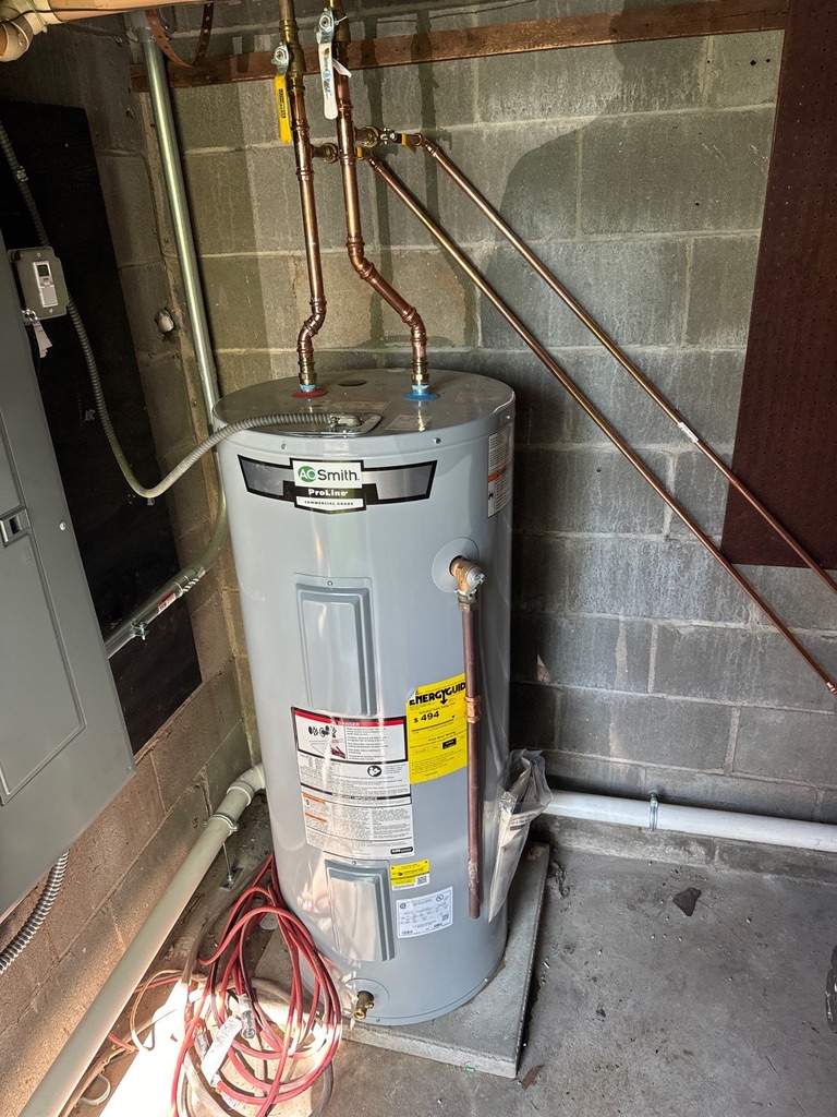 Newly installed AO Smith ProLine water heater with professional copper piping