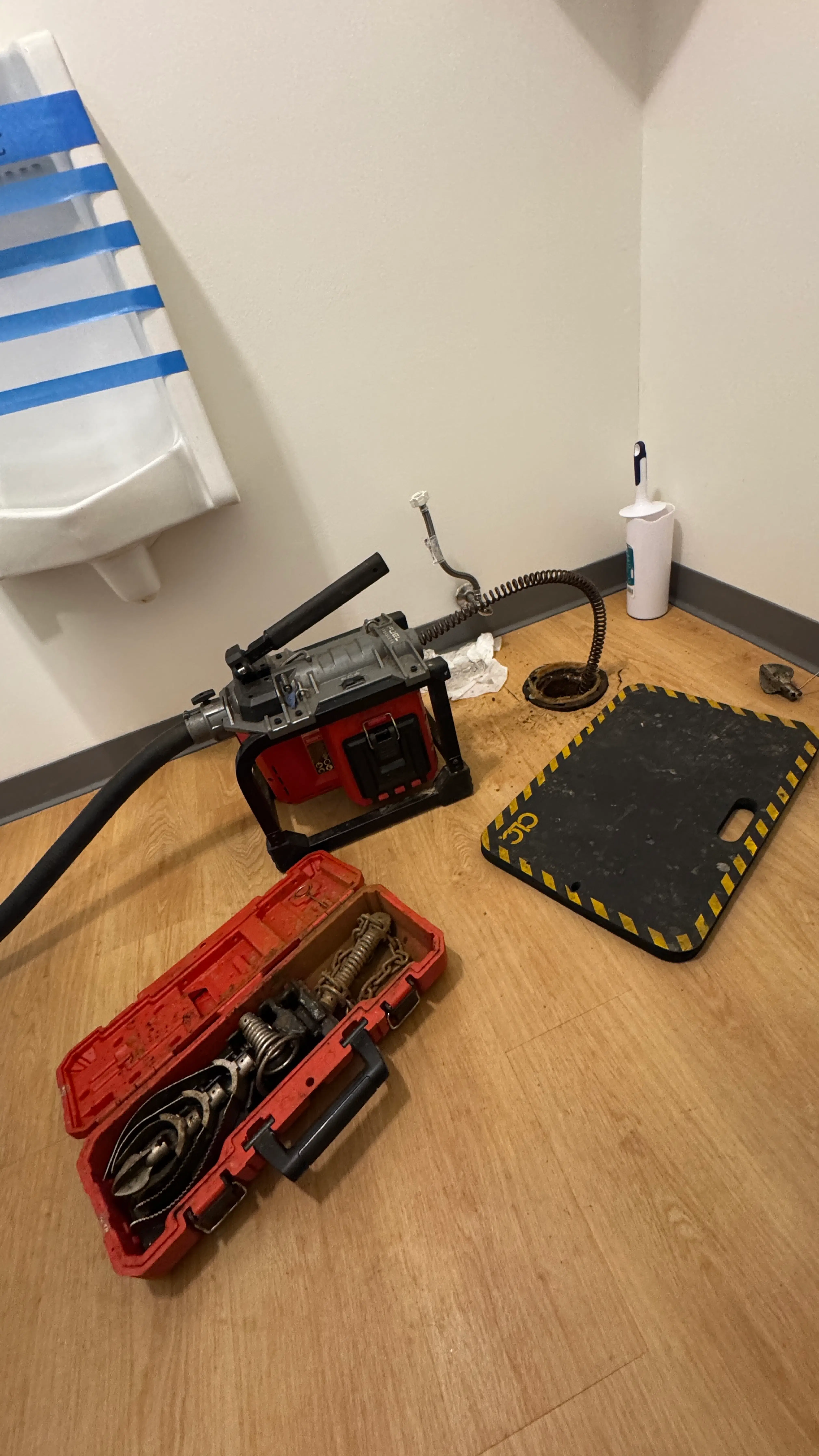 Professional drain cleaning and blockage removal in progress