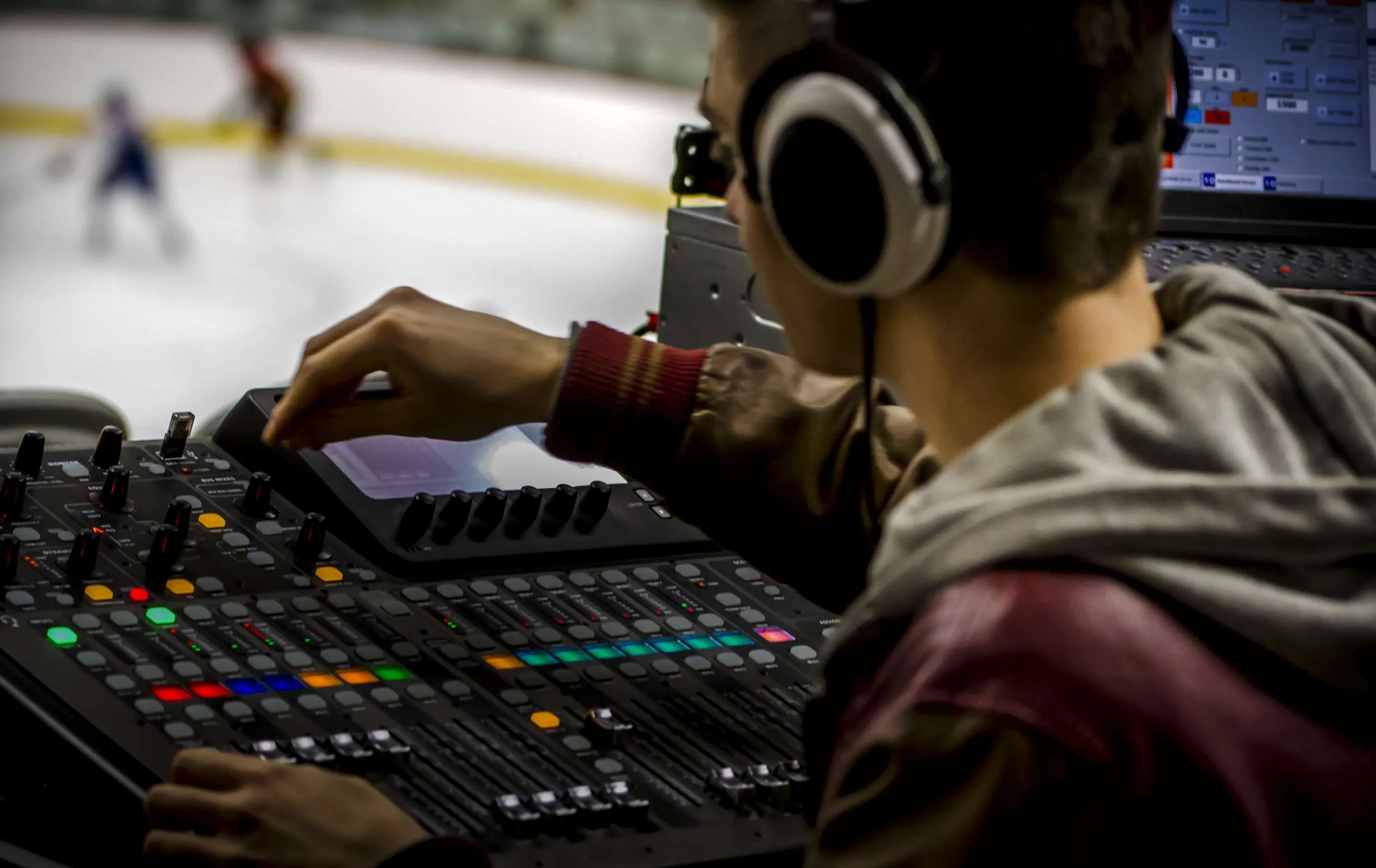 a man audio mixing wearing headphones